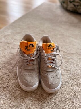 Nike Air Force 1 Low in Beige with Orange Tongue